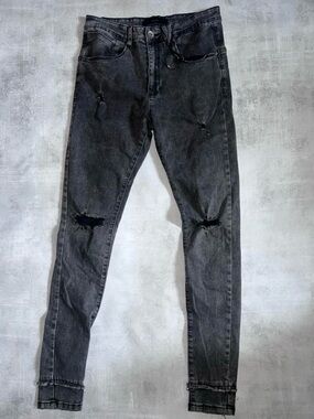 Kollar Denim a faded black or washed charcoal denim finish heavy distressing